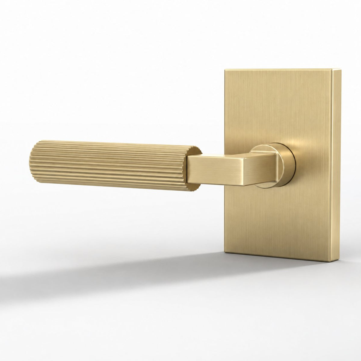 Ridge Collection | Ribbed Lever in satin brass on a white background