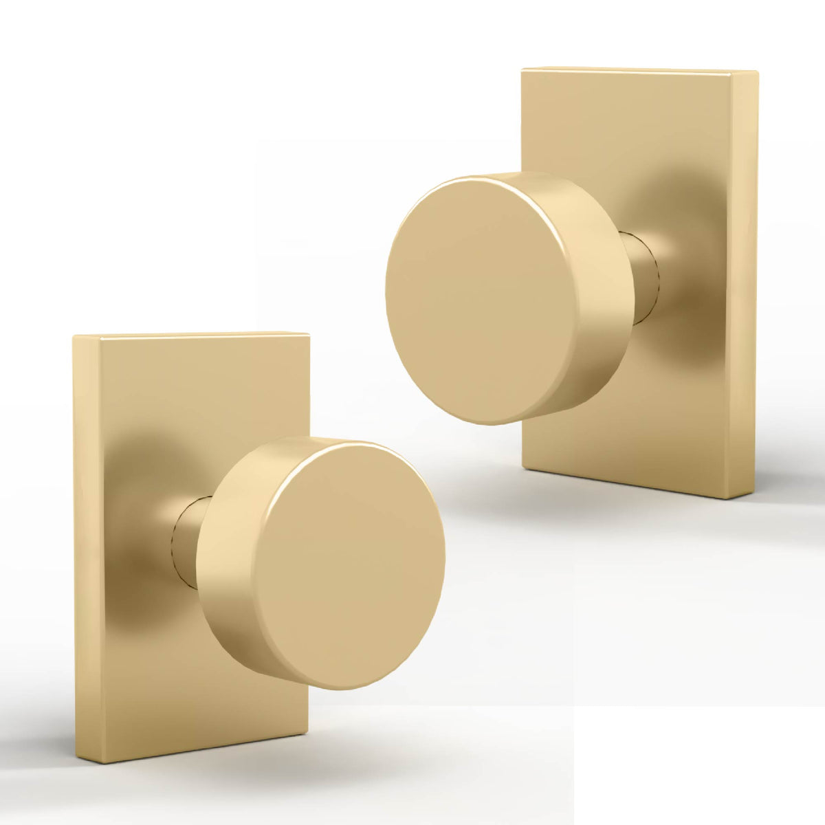 Two Laura Satin Brass dummy door knobs with smooth round grips and rectangular rosettes