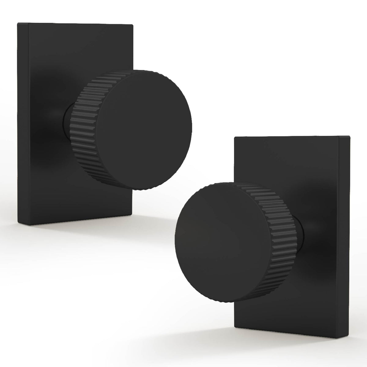 Two Ribba Matte Black dummy knobs with ribbed round grips and rectangular rosettes