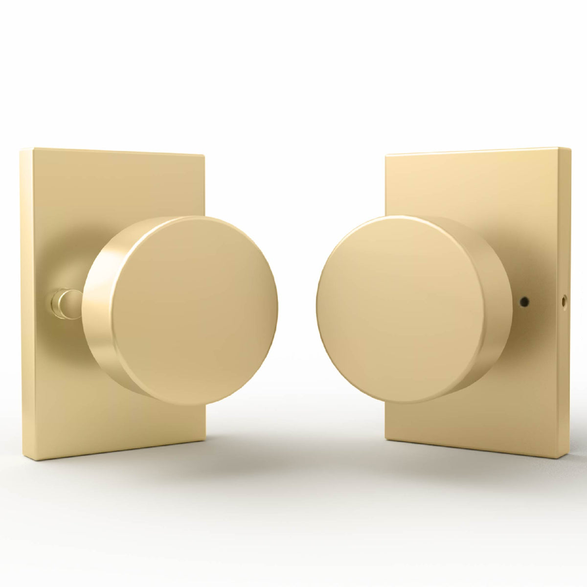 Laura Satin Brass passage knob installed on a dark door with latch visible
